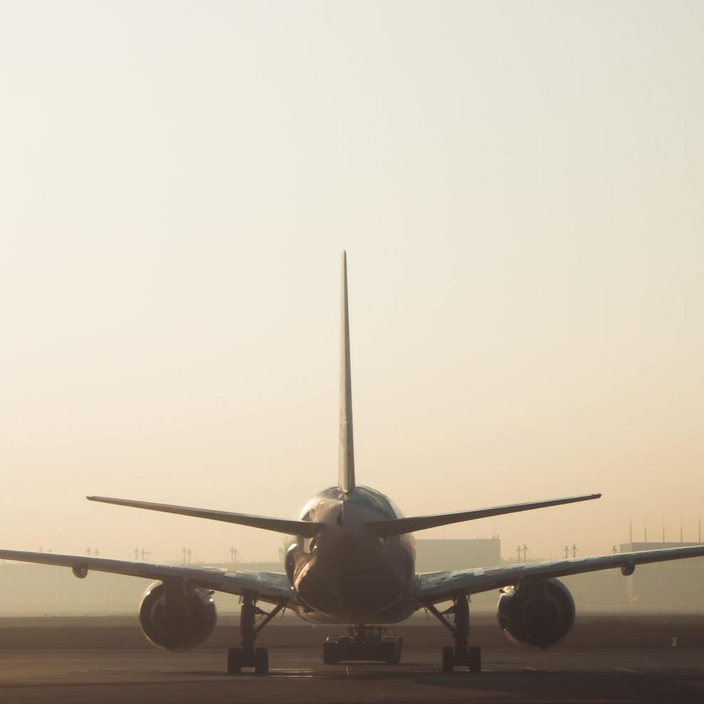 An airplane is in an airport.